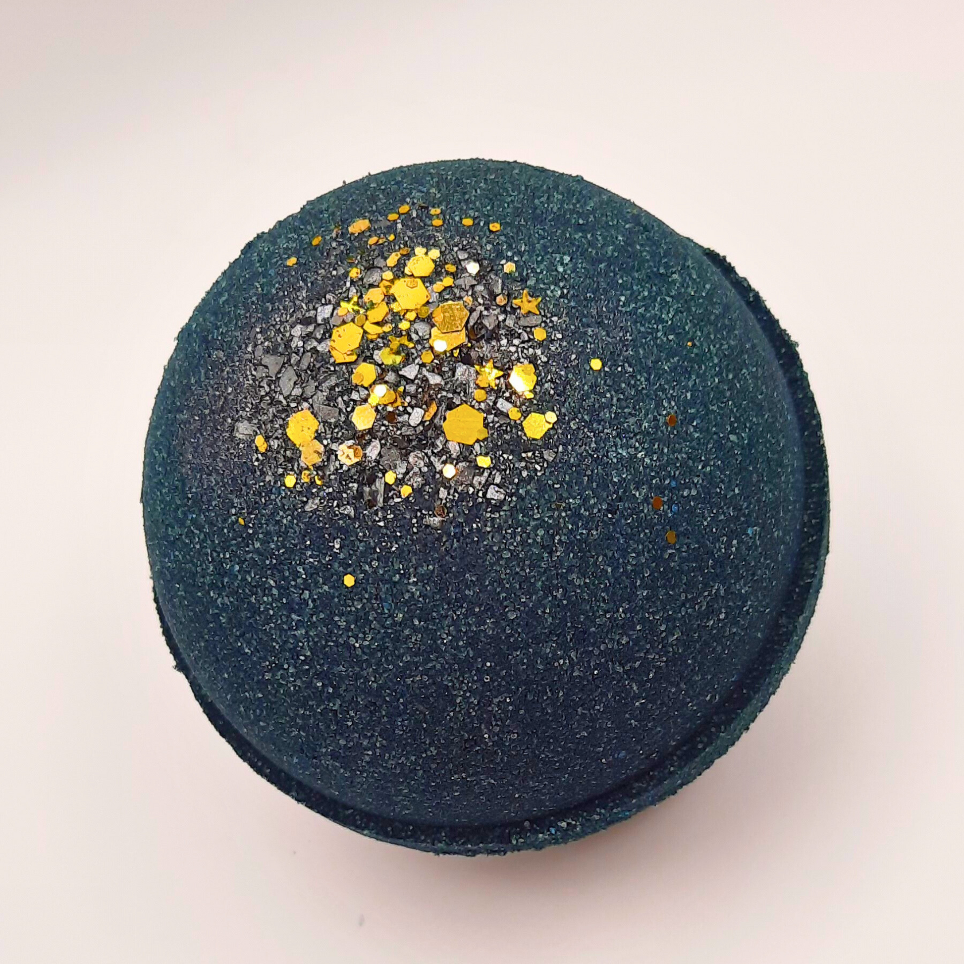 Nightfall Hemp oil bath bomb with gold biodegradable star glitter.